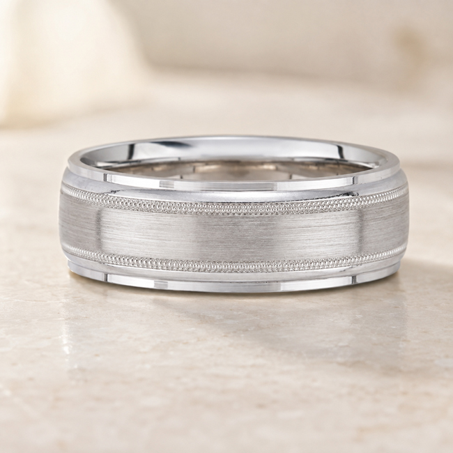 classic retro looking men's wedding band with polished edges, milgrain and center finish